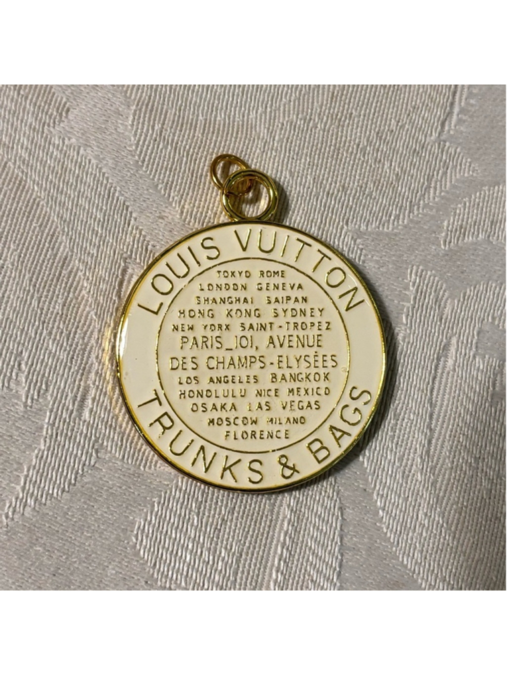 LV Gold and White from the Trunks Pendant Charm New Without Tags